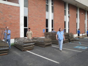 Within a week of the Joplin tornado in 2011, UCM rearranged its furniture replacement schedule to send nearly 500 beds and sets of bedding to the relief effort. UCM’s Brenda Moeder is pictured in front of beds stacked for shipment to Joplin.