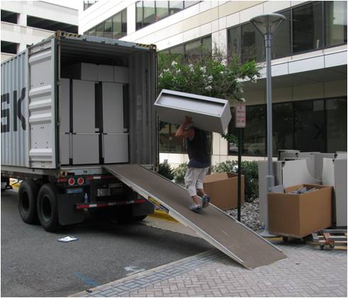 Finishing off a fully cubed out load, McLean, VA. This container was provided to local organizations in Guatemala